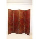 19th century gilt tooled and red lacquered leather four-fold screen decorated with figures and