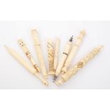 Good collection of eight 19th century carved ivory or bone bodkin cases,