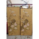 Near pair 20th century Chinese painted screens, each with blossoming trees and rocks,