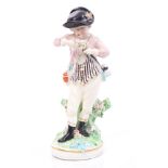 18th century Derby figure of a boy holding flowers, wearing striped waistcoat,