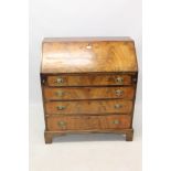 Regency mahogany crossbanded bureau with sloping fall enclosing a fitted interior and four