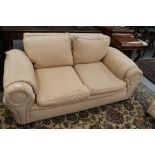 Good quality 1920s two seater settee with patterned upholstery on cream ground