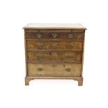 Early 18th century walnut crossbanded and feather-banded chest of diminutive proportions,