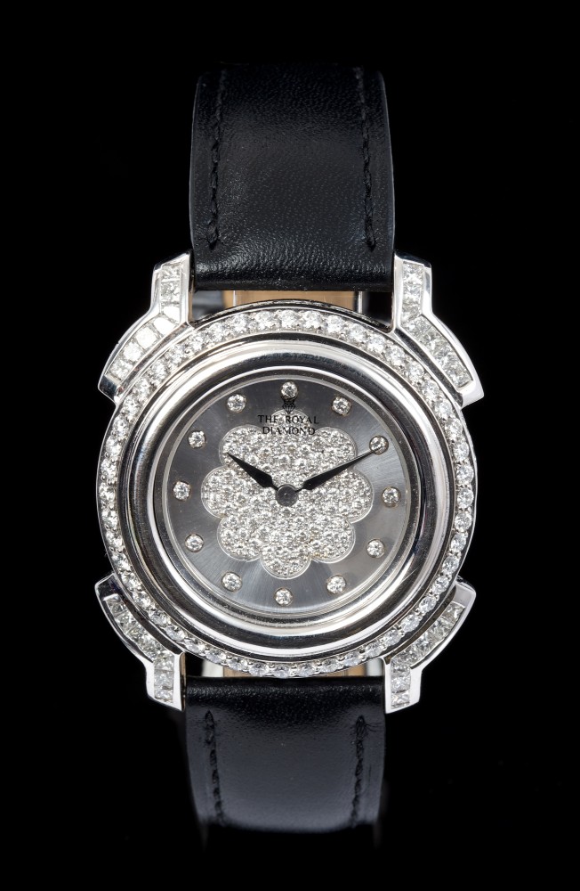 A diamond set quartz wristwatch, by The Royal Diamond, the circular dial with pavé set diamonds,
