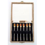 Contemporary set of six unusual cocktail sticks with terminals in the form of enamelled witches