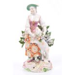 18th century Derby porcelain figure of a shepherdess with sheep, on rococo base, 18.