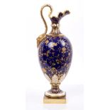 Late Victorian Mintons porcelain ewer-shaped vase with scroll handle and demon mask terminal,