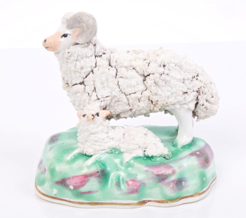 19th century Staffordshire porcelain group of a ram and lamb, on naturalistic base,