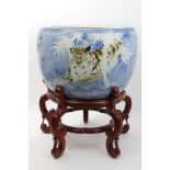 Large late 19th century Japanese jardinière decorated with tigers amidst bamboo,