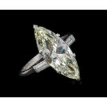 Diamond single stone ring with a marquise-shape diamond weighing 3.