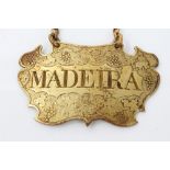 Georgian shaped gilt metal wine label with suspension chain and grape and vine decoration -