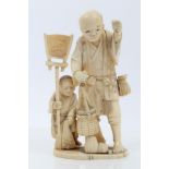 Late 19th / early 20th century finely carved ivory okimono depicting a father and son,