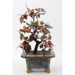 Late 19th century Chinese carved hardstone tree in cloisonné enamel pot with floral decoration,