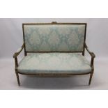 Louis XIV-style carved giltwood sofa with square pad back and seat,