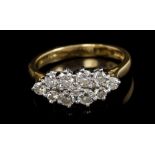Gold (18ct) diamond cluster ring - comprising eleven brilliant cut diamonds in claw setting,
