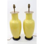Pair of Chinese yellow glazed porcelain table lamps of baluster vase form, with everted rim,