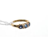 Late Victorian gold (18ct) sapphire and diamond seven stone ring with three mixed cut blue