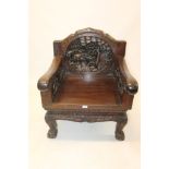 Set of four Indo-Chinese carved hardwood chairs, each with substantial carved back,