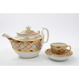 Early 19th century Coalport teapot and cover and matching tea cup and saucer with red,