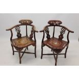 Set of four Chinese hardwood and mother of pearl inlaid elbow chairs, each of horseshoe form,