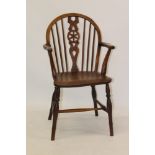 19th century elm and fruitwood Windsor chair with wheel back and solid seat on turned legs with