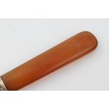 Fabergé-style white metal banded carved amber paper knife of taping form,