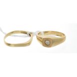 Two yellow metal rings set with diamonds,