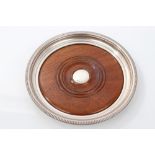 Contemporary silver magnum bottle coaster of circular form, with flared rim and gadrooned border,