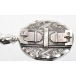 Large Victorian silver oval locket with applied double buckle to the front (Birmingham 1892),