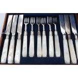 Composite set of twenty-four pairs of silver dessert knives and forks with carved and initialled