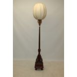 Chinese red lacquered and parcel gilt standard lamp on turned column and quatrefoil base
