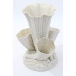 Belleek porcelain shell table centre with a trumpet-shaped vase on rocky shell and seaweed base -