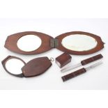 19th century teak campaign set comprising two mirrors of hinged oval form,