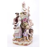 Large mid-19th century Meissen porcelain group of a musical family with putti and goat on rocky