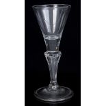 18th century Dutch wine glass with funnel bowl and six-sided Silesian stem on splayed foldover foot,