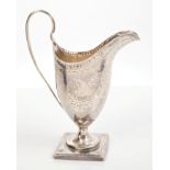 George III silver helmet cream jug with bright cut floral engraving and dot-punched rim,