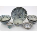 Collection of six 17th / 18th century Chinese blue and white bowls and similar dish with floral