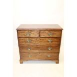 George III mahogany chest of drawers, having two short over three long graduated drawers,