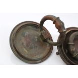 Impressive pair of antique brass door knockers, each with large handles and circular back plates,