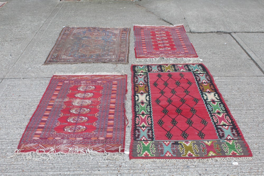 Kelim rug with geometric design against a blood-red field, 200cm x 102cm,