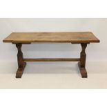 17th century-style oak refectory table with plank top on square standard ends and sledge supports,