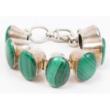 Malachite bracelet with seven oval cabochon malachite stones in white metal setting with T-bar