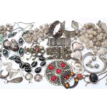 Group of silver and white metal Eastern-style jewellery including bangles, pendants, chains,