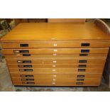 1960s oak plan chest, in two parts, with nine drawers, on plinth base,