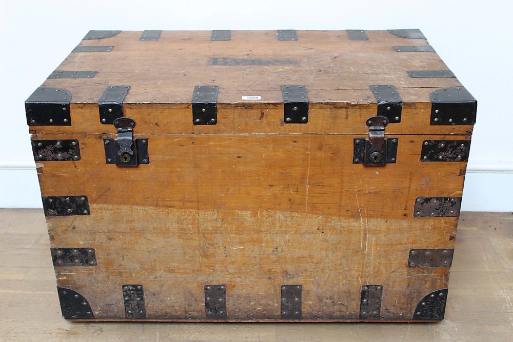 Late 19th century pine and metal bound trunk with end carrying handles,