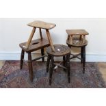 19th century elm stool with pierced seat on four splayed turned legs,
