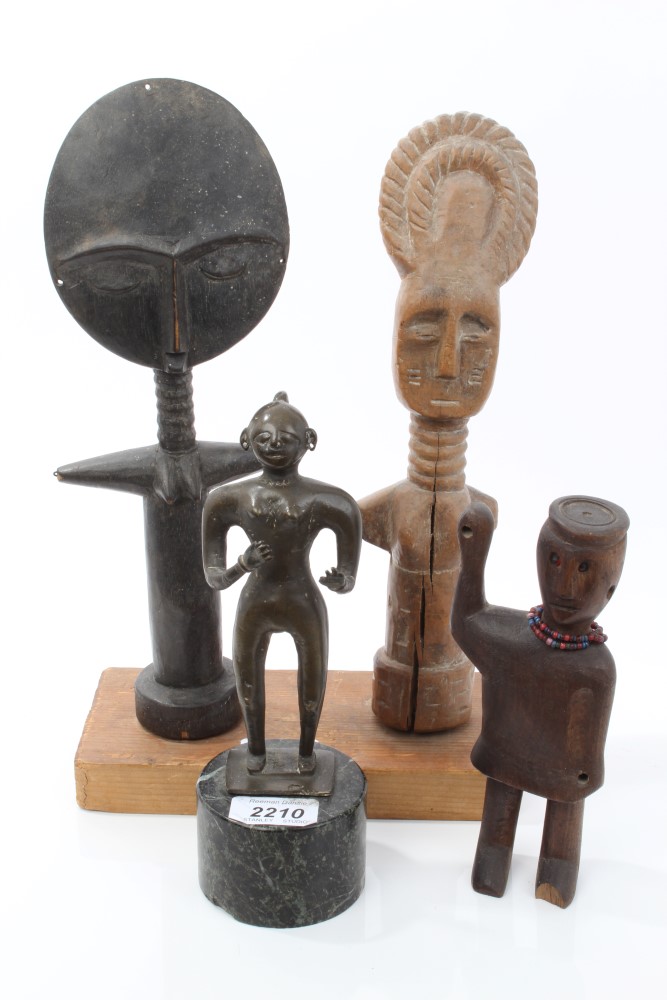 Group of African tribal figures - including a bronze figure on marble plinth,