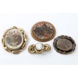 Victorian mourning brooch with hairwork floral decoration, in glazed compartment,