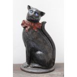 Unusual late 19th century painted cast iron fireside companion in the form of a seated cat,