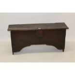 17th century oak six-plank coffer on V-cut end supports,